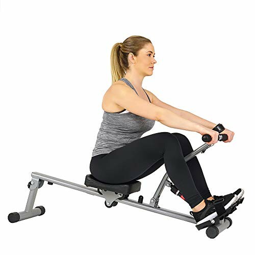 Woman exercising on a rowing machine.